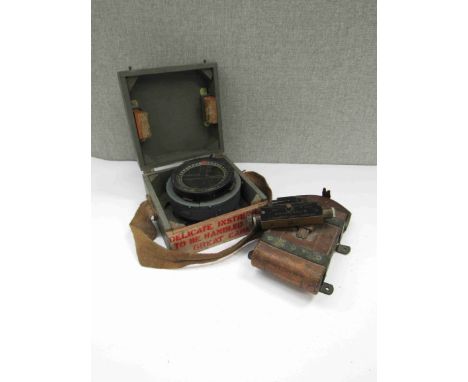 A WWII P8M aircraft compass with fitted case, together with a leather cased WWI 1918 Kershaw Clinometer Sight Mk. III
