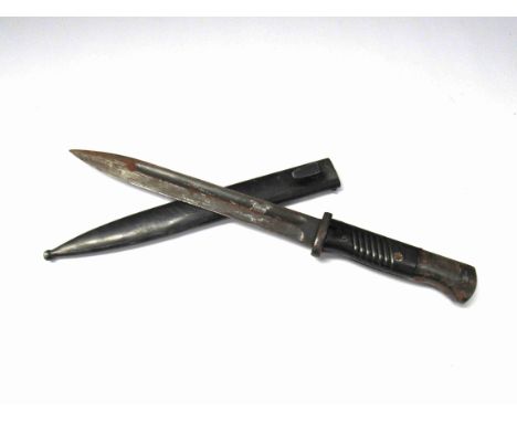 A Third Reich era German K98 bayonet with 3536 stamp to blade, storage corrosion, with scabbard 