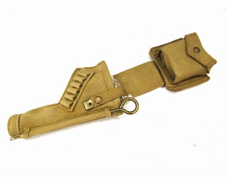 An Enfield 1938 dated canvas holster, compass and whistle "Blanco" 