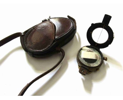 A WWI 1918 dated compass with leather case