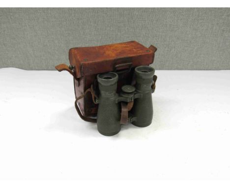 A pair of WWII era German army field glasses by Oigee of Berlin. Green textured with leather strap and Oigee embossed origina