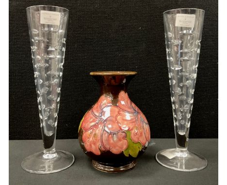 A Moorcroft vase, hibiscus pattern, 13cm high;  a pair of Waterford crystal Jasper Conran 'Rain' design champagne flute glass