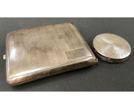 A George V silver cigarette case, engine turned strips, Birmingham 1931, 10cm x 8cm;  a similar circular powder compact, Birm