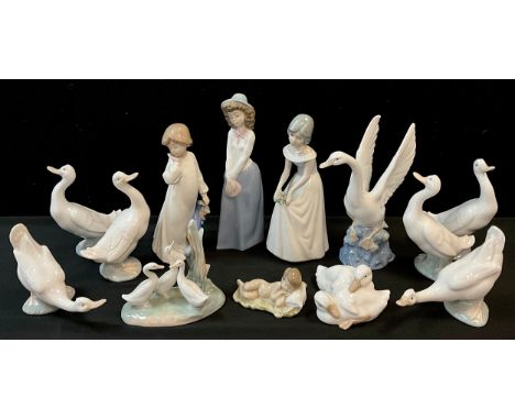 A group of Nao Lladro ceramic duck models, the largest, 21cm high;  others, various poses;  Nao figures of girls;  another, P