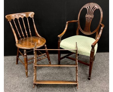 A 19th century oak spindle back chair;  a George III style elbow chair;  mahogany three tier wall shelf, (3).