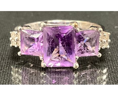 A 9ct White Gold African Amethyst and Diamond Ring;set with a pale purple rectangular step cut amethyst in the centre with a 