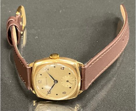 A 1950s Mappin 9ct gold cased wristwatch, silver dial, alternating Arabic numerals and square dot baton markers, manual wind 