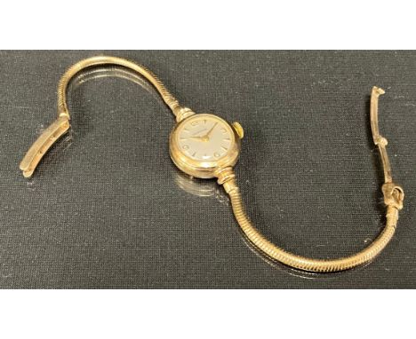 A Certina 9ct gold cased lady's wristwatch, silver dial, Arabic numerals and Arrow baton markers, manual wind 12-11 movement,