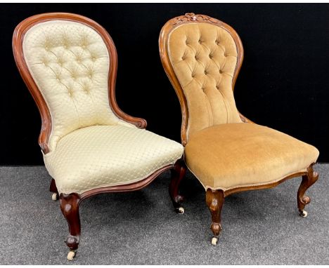 A Victorian carved walnut balloon-back nursing chair, button upholstered back, sprung seat, cabriole legs, with ceramic caste