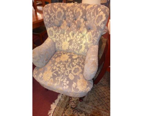 A pair of mid 20th century button back armchairs, with embossed floral damask upholstery, raised on cabriole legs 