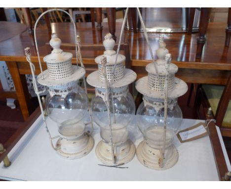 A set of three storm lantern 