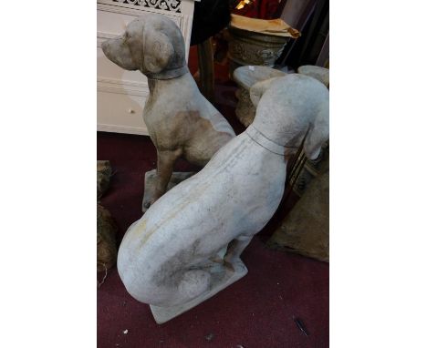 Two reconstituted stone hunting dogs, seated on rectangular bases, H.74cm (2) 