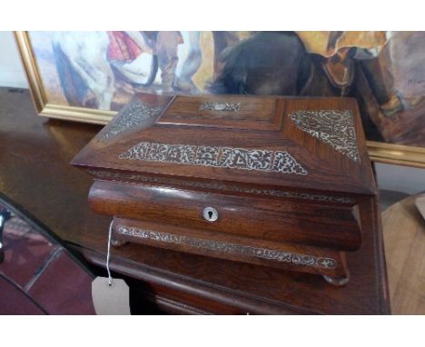 A 19th century rosewood tea caddy having shell fretwork and coromandel wood compartmentalised interior, H.20cm W.34.5cm 