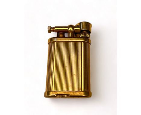 A vintage gold plated Dunhill 'Unique' lighter In a reeded and fluted case, stamped 'Dunhill, Unique', serial number 406626,&