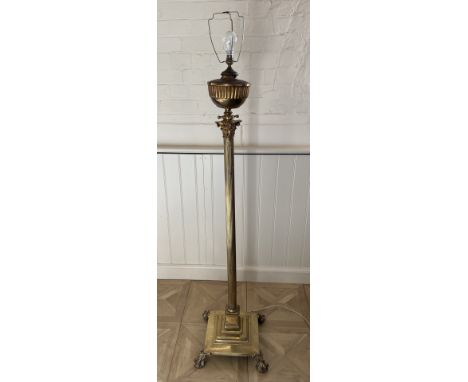 A brass standard lamp and and green onyx table lamp The standard lamp converted from an oil lamp, with Corinthian column stem