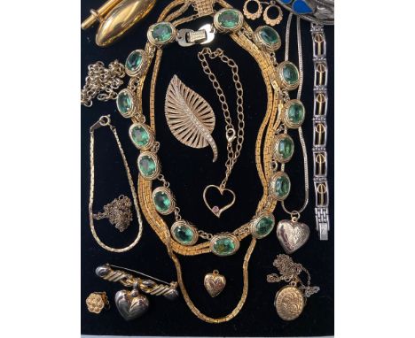 A group of costume jewellery
Including a pair yellow metal loop earrings 1g (tested as 9ct); a bar brooch by Monet; a leaf br