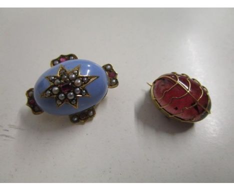 An early 19th century yellow metal and sky blue enamel brooch, the top with red gem set stone surrounded by seed pearls in a 