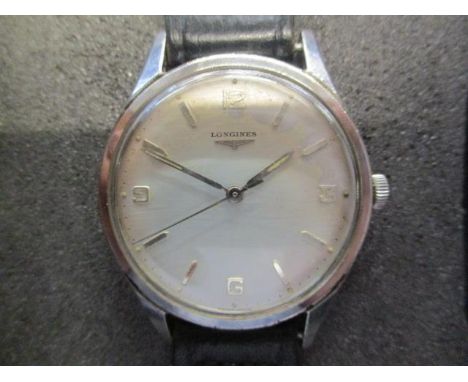A Longines gents, manual wind, stainless steel wristwatch, the silvered dial with baton markers and Arabic numerals and centr
