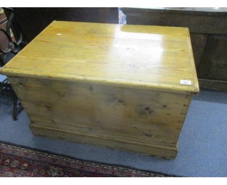 An early Victorian pine travelling trunk with wrought iron handles 