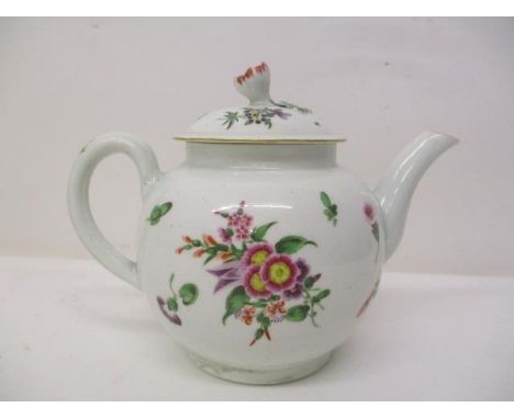 A mid/late 18th century bulbous teapot with a domed lid, flower finial, applied leaves, decorated with sprigs and single flow