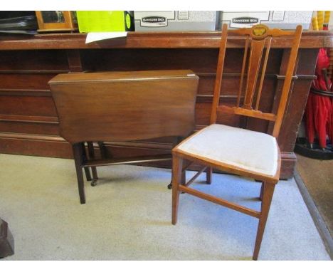 An Edwardian mahogany Sutherland table and an Edwardian mahogany inlaid side chair with upholstered seat 