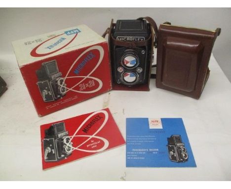 A Miroflex Micro Precision Products camera with a 77.5mm 3.2 lense, serial number 280316, in a brown leather case, manual and