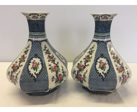 A pair of vintage Losol Ware 'Yeddo' pattern vases. By Keeling & Co. Ltd. Chip to one rim. Approx 25cm tall.
