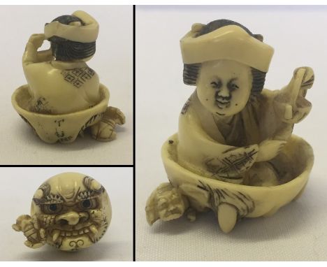 A signed Japanese netsuke. Tea ceremony figure to top with lion face below. 