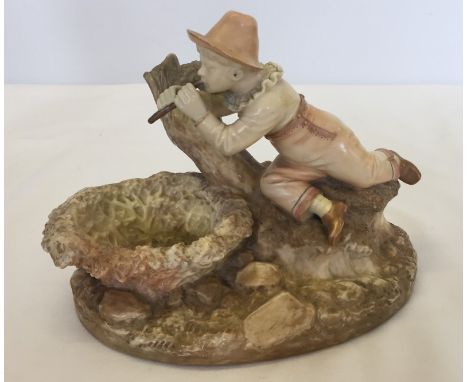 A Royal Worcester Kate Greenaway figurine / trinket bowl of a boy playing a pipe. Dated 1888, pattern #1232, impressed and pr