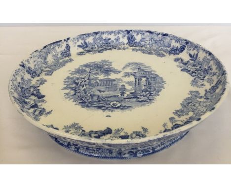 A 19th century blue and white ceramic footed dish.  Approx. 30cm diameter and 6.5cm tall.