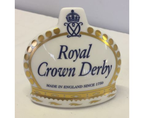 A Royal Crown Derby ceramic advertising plaque.  Approx 9cm tall.