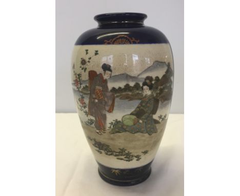 Vintage Japanese Satsuma vase. Geisha decoration on cobalt blue ground. Approx 23cm tall.