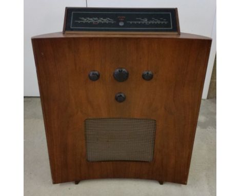 A vintage Art Deco style Murphy 188 radio. Curved front, walnut veneered.  First released 1951 and first shown at the Festiva