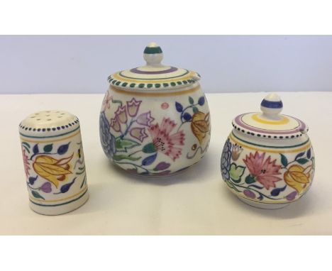 3 items of Poole pottery with a floral pattern. Comprising jam pot, mustard pot and pepper pot. 