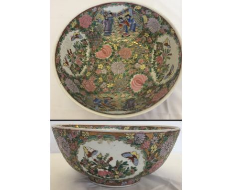 A large Chinese ceramic punch bowl. With gilt and flower decoration. Approx. 15cm tall and 31 cm diameter.