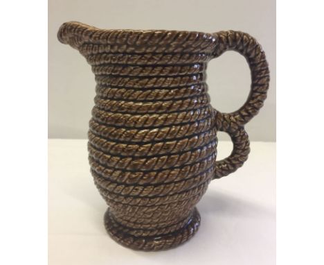 A vintage Govancroft coiled rope jug, 20cm tall.  