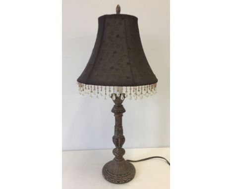 A table lamp with brown shade with drops.  61cm tall.