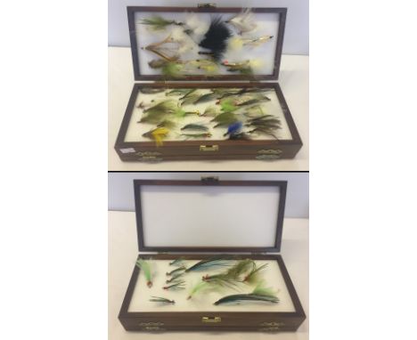 A dark wooden box of vintage fishing flies. Approx. 70 large flies. 