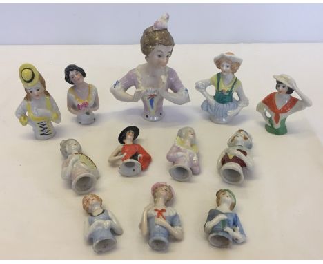 A quantity of 12 ceramic half dolls of various sizes.  Largest approx 13.5 cm tall