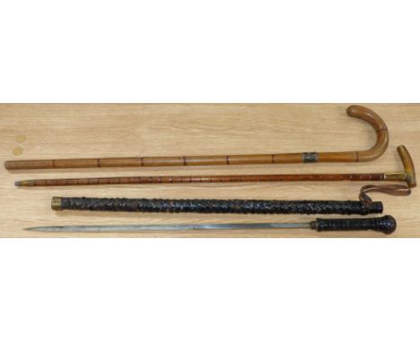 A 19th century swordstick with plaited leather strap covering; 2 other sticks