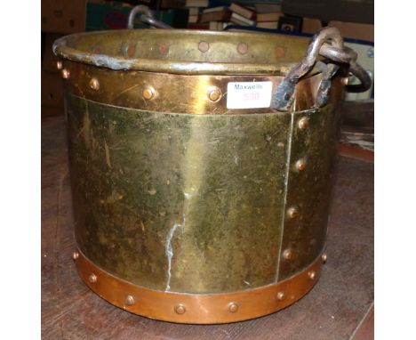 A copper coal bin with steel swing handle and a firescreen with embroidered panel