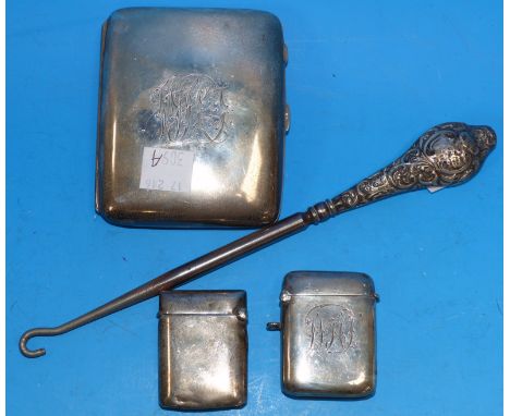 A hallmarked silver cigarette case, monogrammed, Birmingham 1933; 2 hallmarked silver vesta cases and a button hook - 4oz