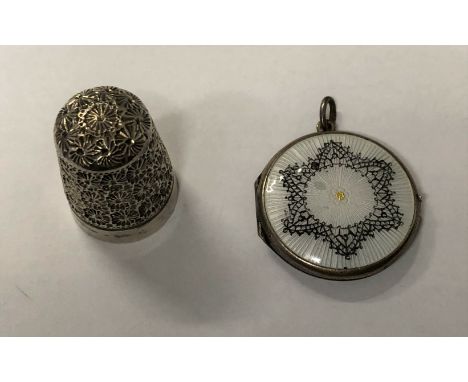 SILVER THIMBLE AND A SILVER AND GUILLOCHE ENAMEL LOCKET