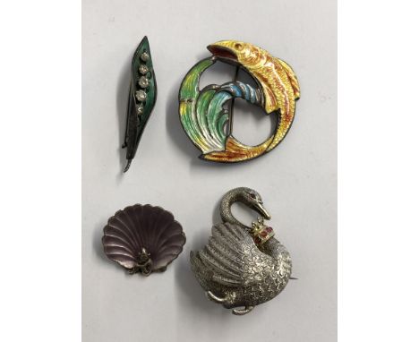SILVER AND ENAMEL PIXIE IN SHELL BROOCH,ENAMEL LEAPING FISH BROOCH,SILVER ENAMEL LILY BROOCH AND WHITE METAL SWAN BROOCH