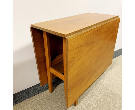A 1970's drop leaf light oak dining table, W. 81cm.