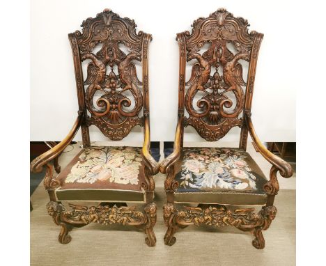 A pair of large 19thC tapestry upholstered, intricately carved oak throne chairs, H. 145cm. Prov. Little Wakering Hall. Some 