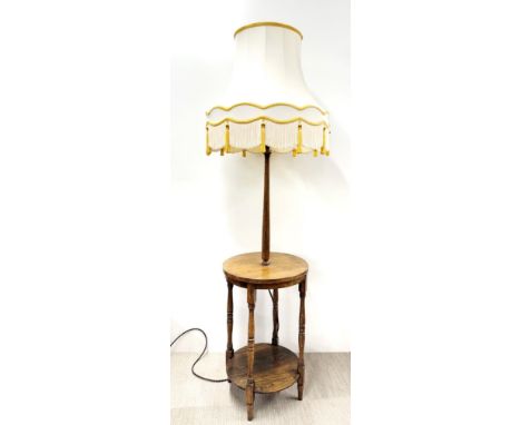 An oak two tier standard lamp table and shade, overall H. 183cm. Prov. Little Wakering Hall