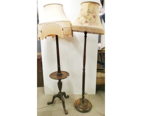 A carved wooden standard lamp wine table and shade with a further standard lamp and shade, largest overall H. 186cm. Prov. Li