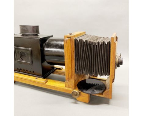 A 19thC lantern slide projector, L. 60cm.