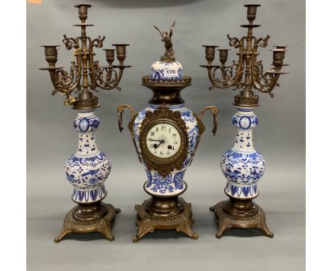 A continental bronze mounted Delft style clock garniture, H. 60cm.